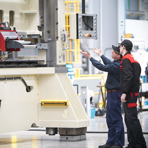 technical-support-1 nidec technical support working on a machine